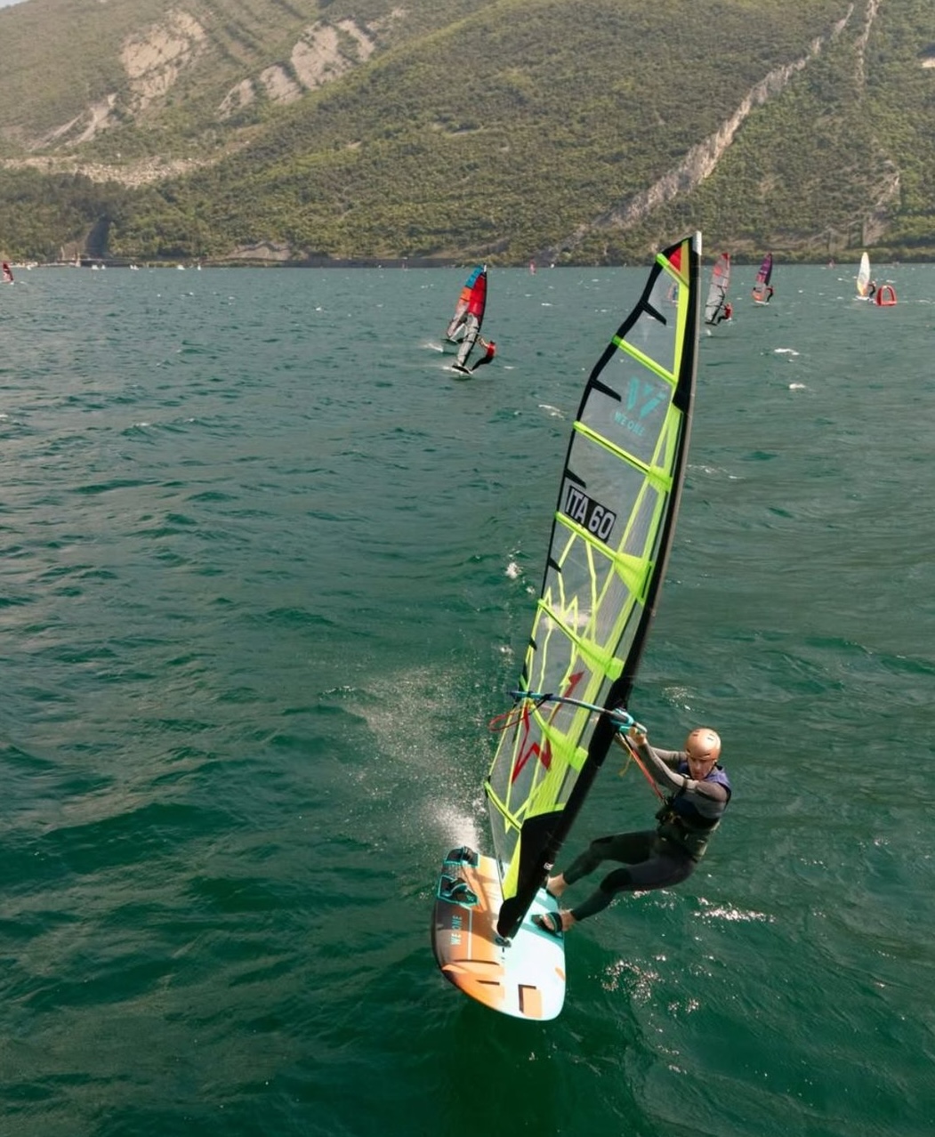 Aerial shot of Daniele Benedetti ITA 60 racing on Lake Garda with CHS Wind Solutions sail