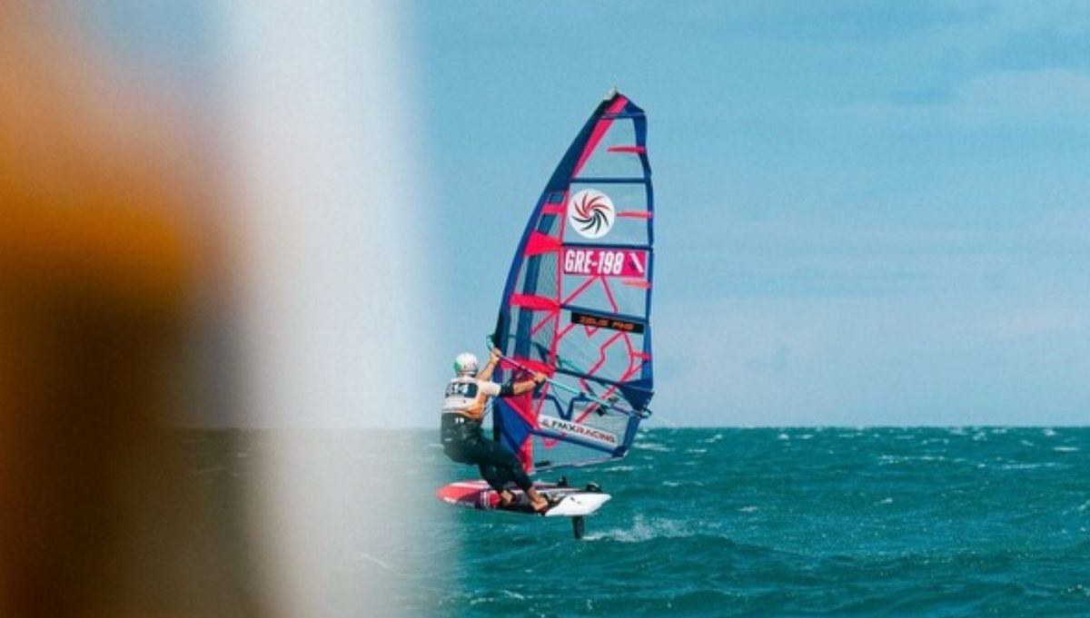John Soukos (GRE-198) on foil with his CHS Challenger sail during the 2026 Défi Wind long-distance race in Gruissan, France.