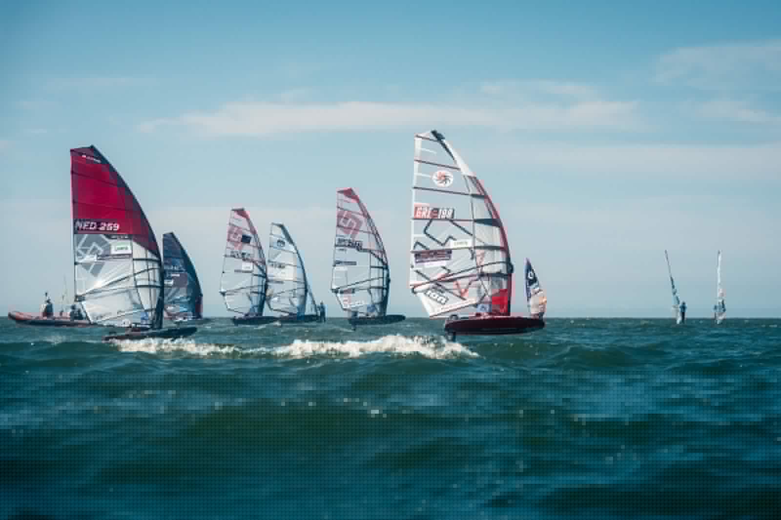 John Soukos GRE-198 racing among the international foil fleet at the 2026 IFCA Foiling European Championships in St. Peter-Ording