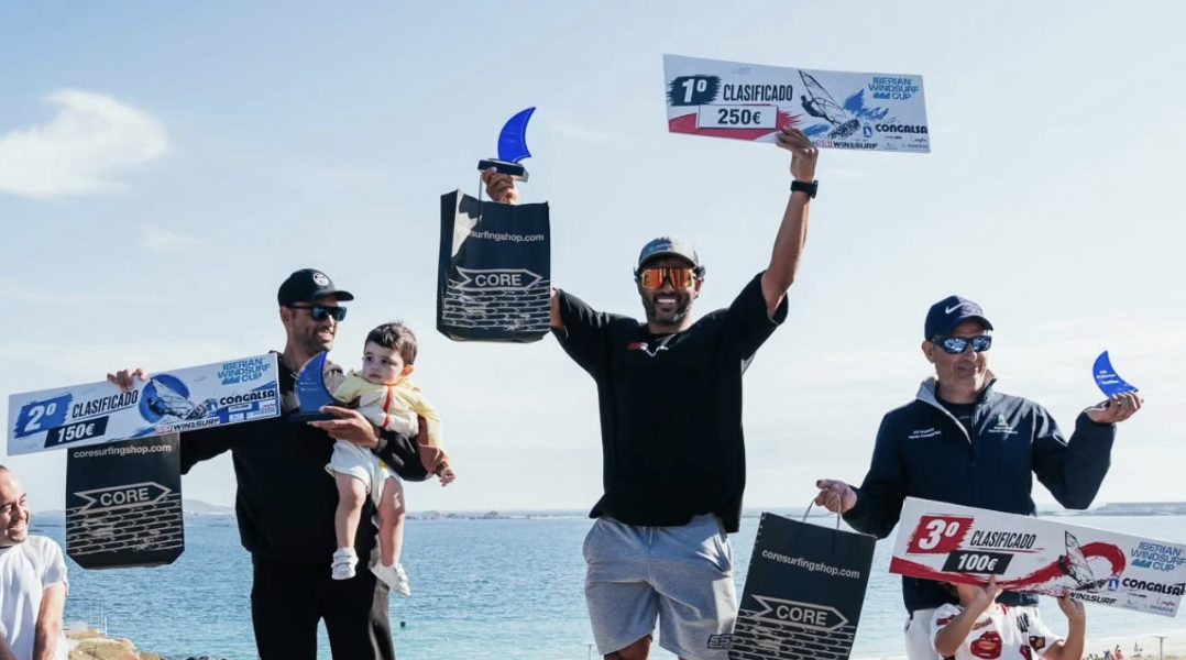 Klayton Silva on the top step of the 2026 Iberian Windsurf Cup podium holding the 1st place prize