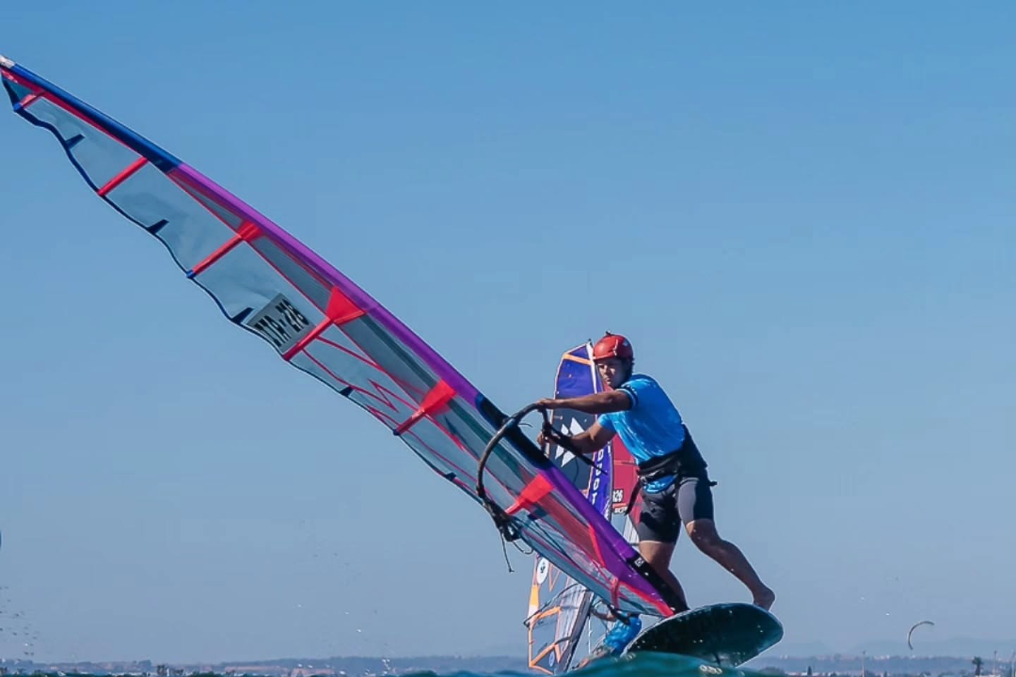 Youth rider Gabriele Prosperi ITA-278 foiling on a CHS sail during the 2026 slalom season